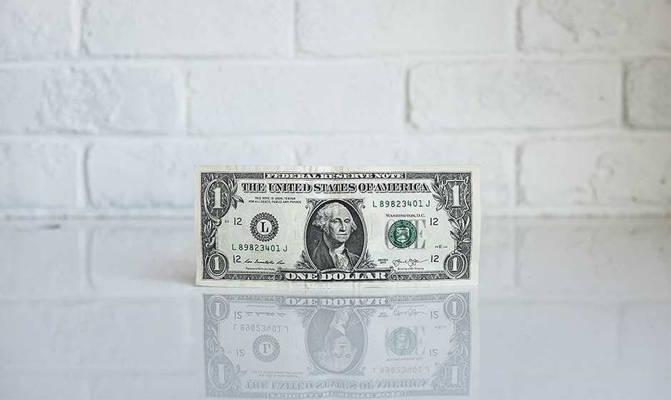 Dollar-bill-on-class-table